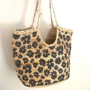 Fabulous straw bag purse with black flowers. Large and very well-made.